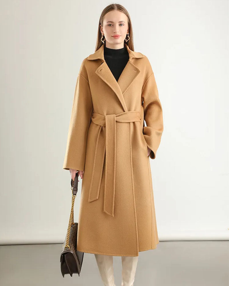 Woman city-strolling in the A-Line Pure Wool Belted Trench Coat, double-faced 19.5-micron Merino and small turn-down collar give heritage polish—your wind-proof 35-55 °F fall-through-spring commuter layer.