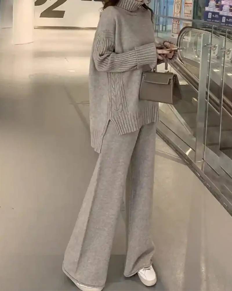 Co-ord set of oversized wool turtleneck sweater and fluid wide-leg trousers, heather taupe—head-to-toe warmth for winter workdays or weekend brunch.