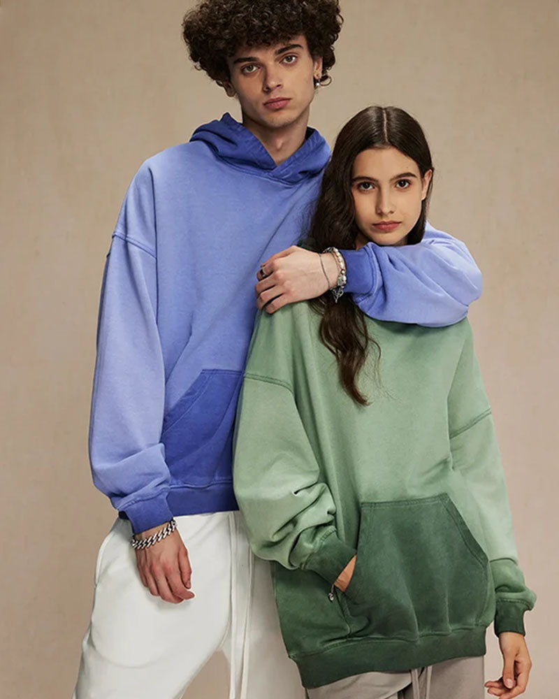 Woman lounging in a sand-beige retro-washed cotton hoodie, acid-washed fleece and dropped shoulders give vintage 90s vibes—your cozy 60–75 °F spring-fall layer.