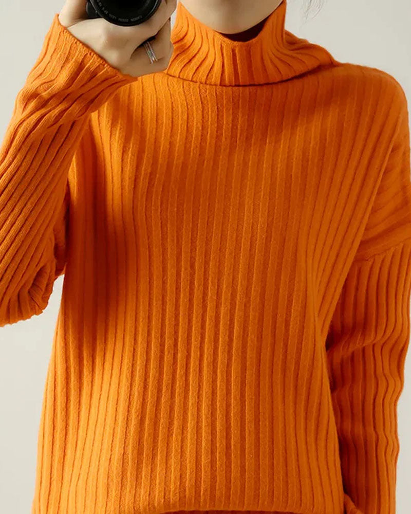 Woman city-walking in the Ribbed-Knit Turtleneck Wool Sweater, 100 % wool fisher-rib and tall roll-neck lock in warmth—your wind-proof 45-65 °F fall-through-spring essential.