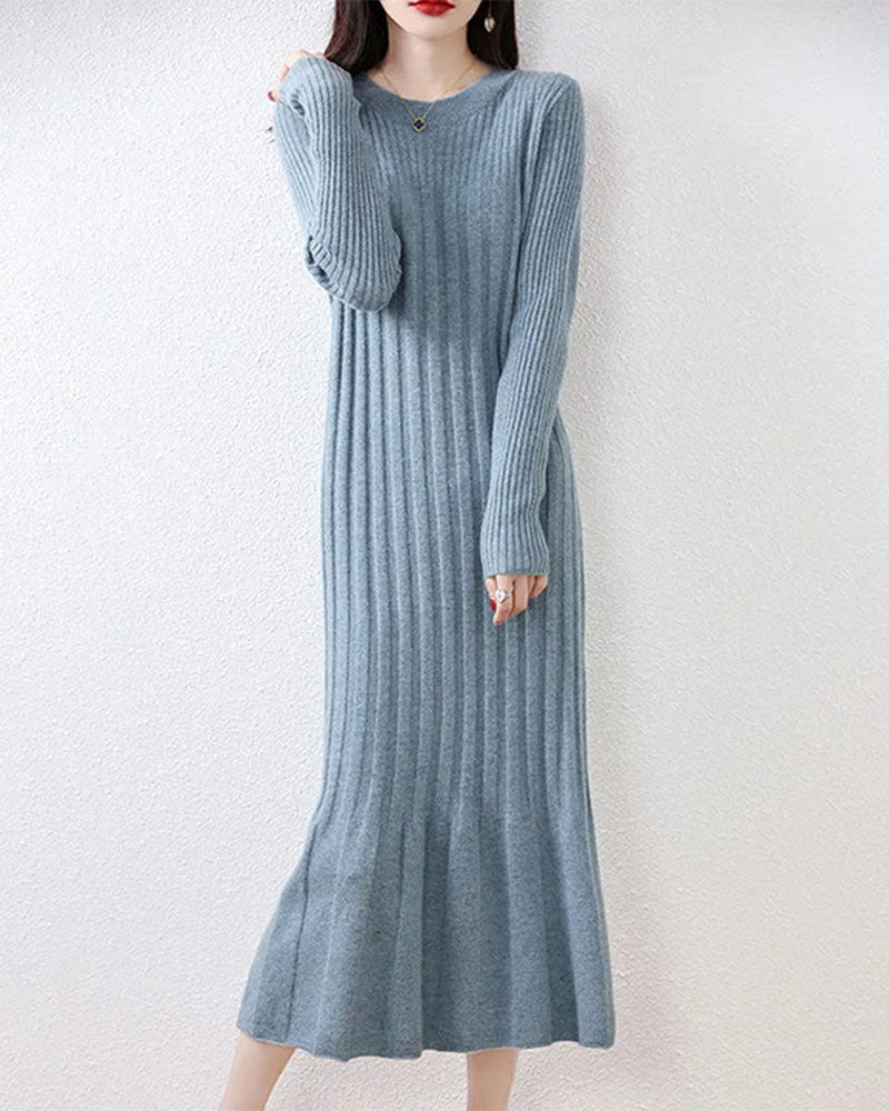 Woman posing in the Round-Neck Long-Sleeves Wool Dress, 19.5-micron 100 % Merino rib drapes like jersey—your luxe yet breathable 45-65 °F fall-through-spring statement.