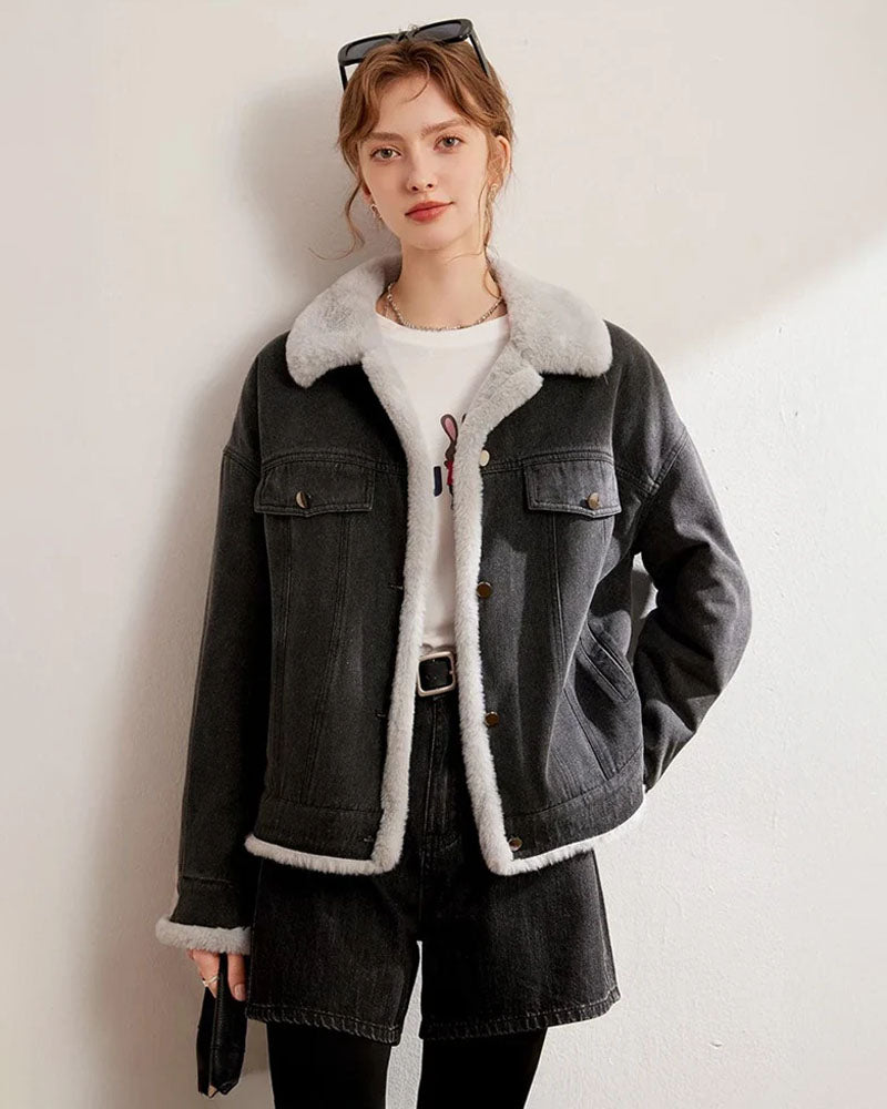 Woman layering a thickened fleece-lined denim jacket, vintage wash outside and plush shearling inside—wind-proof warmth for 30-50 °F fall-to-winter weekends.