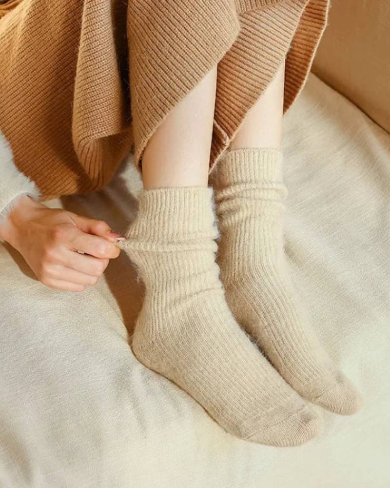 Cold-weather wool-blend socks with gentle stretch, mid-calf height, heather gray—moisture-wicking warmth for boots or lounging.
