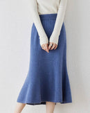 100 % merino-wool fishtail skirt, bias-cut flared hem, midi length, soft camel—elegant winter knit that pairs with boots or heels.