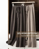 100 % merino-wool wide-leg pants, drawstring high waist, ankle-skimming length, heather taupe—cloud-soft warmth for winter lounging or city outings.