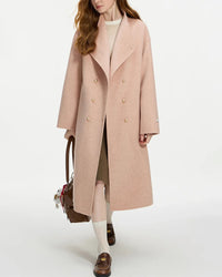 Man in knee-length camel Ulster coat crafted from pure merino wool, eight-button front blocks city chill while martingale back shapes a refined silhouette.