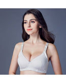 Woman lounging in the Zhangyan Plain-Weave Bra, feather-light cotton-ammonia fabric and wireless ¾-cup give invisible lift—your breathable 70-85 °F summer-to-fall essential that vanishes under backless tops .