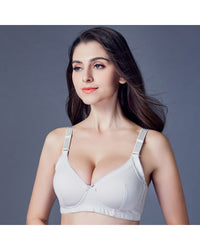 Woman lounging in the Zhangyan Plain-Weave Bra, feather-light cotton-ammonia fabric and wireless ¾-cup give invisible lift—your breathable 70-85 °F summer-to-fall essential that vanishes under backless tops .