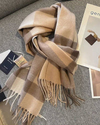Oversized checked 100 % wool scarf, classic tartan, hand-tied fringed edges, soft camel & navy—winter wrap that elevates coats or knitwear.