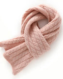 Woman looping the Classic Cable-Knit Cashmere Short Scarf, 19-micron 100 % cashmere and honey-comb cables give cloud-soft warmth—your luxe yet breathable 35-55 °F fall-through-spring wrap that doubles as a neck-warmer on flights.