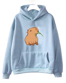 Woman lounging in a funny-capybara-print hoodie, pastel 420 gsm cotton fleece and relaxed dropped shoulders give playful 90s vibes—your cozy 60-75 °F spring-fall layer.