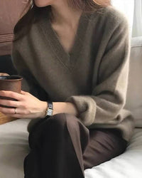 Gentle Herd slouchy V-neck wool sweater, relaxed fit, ribbed cuffs, heather taupe—soft merino warmth for winter layering or solo wear.
