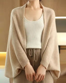 Woman layering a sand-beige Multifunctional Wool Knitted Shawl Scarf, 100 % superfine wool and 90 × 200 cm dimensions drape like a cloud—your cozy yet breathable 45-65 °F fall-to-spring wrap that doubles as a blanket on long flights.