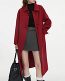 Woman strolling autumn streets in a new-Chinese-style 100 % wool long coat, mandarin collar and frog-button placket merge heritage elegance with modern warmth for 35-55 °F days.