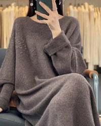 Cloud-soft oversized cashmere dress, relaxed round neckline, drop-shoulder sleeves, midi length—effortless winter luxury for her.