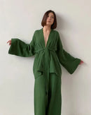 Woman lounging in a Pure-Cotton Robe and Trousers Lounge Set, airy 100 % cotton jersey and relaxed V-neck robe give spa-level comfort—your breathable 70-85 °F summer-night essential.