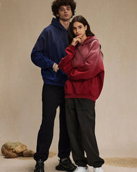 Woman street-styling a retro-gradient washed hoodie, sun-fade lilac-to-mint dip-dye and distressed holes give lived-in 90s attitude—perfect lightweight fleece for 60-75 °F spring-fall layering.