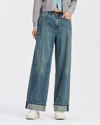 Woman brunching in vintage-wash rolled-hem wide-leg jeans, 25 '' inseam crop shows off ankle boots while the mid-rise waist keeps the look relaxed yet polished for 60-75 °F spring days.