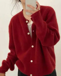 100 % merino-wool cardigan, round neckline, cropped length, ribbed hem, soft oatmeal—lightweight layer for spring-to-fall outfits.