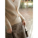 Designers' V-neck Wool Sweater with Asymmetrical Buttons