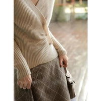 Designers' V-neck Wool Sweater with Asymmetrical Buttons