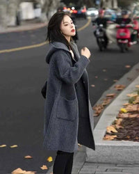 Soft dove-gray, single-breasted cashmere cardigan with hoodie—ribbed texture, horn-style buttons, cozy layer for winter workdays or weekends.