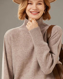 Woman brunching in a Turtleneck Solid-Color Cashmere Sweater, 19-micron Mongolian fibers and relaxed drop-shoulders give cloud-soft warmth—your luxe yet breathable 55-70 °F cold-season essential.