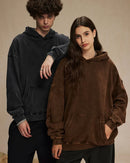 Woman street-styling a vintage batik-washed cotton hoodie, 420 g acid-wash fleece and hand-dyed indigo swirls give lived-in 90s attitude—perfect breathable layer for 60-75 °F spring-fall nights.