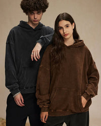 Woman street-styling a vintage batik-washed cotton hoodie, 420 g acid-wash fleece and hand-dyed indigo swirls give lived-in 90s attitude—perfect breathable layer for 60-75 °F spring-fall nights.